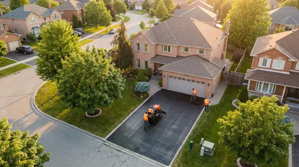 Castle Driveway professional asphalt crew working on a residential driveway in Westchester County